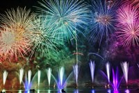 Fireworks in the sky being shot up from a number of locations