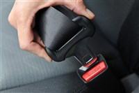 Seat belt being buckled by driver